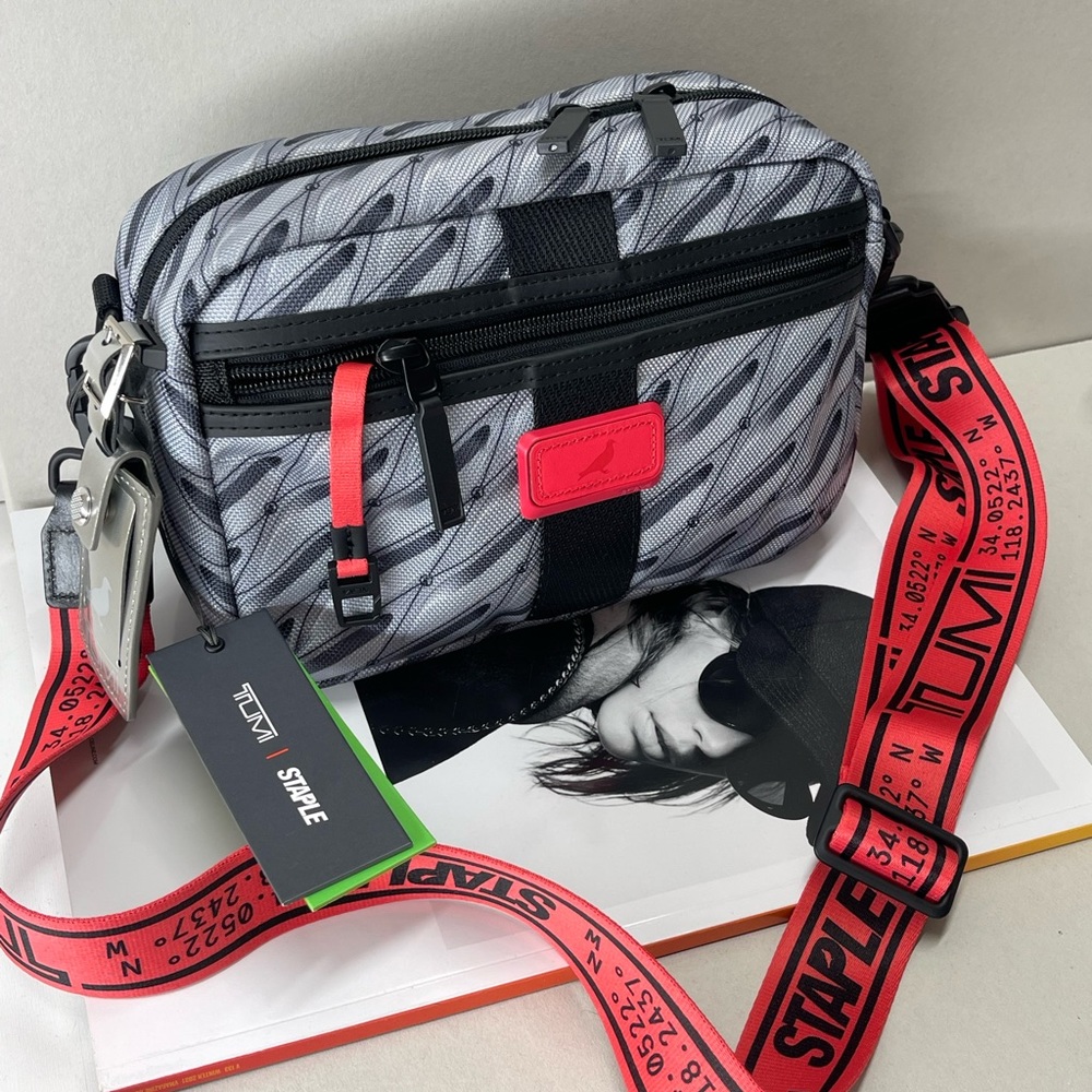 Used  TUMI x Jeff Staple Kit Crossbody Men/Women — pigeon monogram + strap.